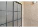 Closeup of metal framed patio door with textured stucco wall to the side at 1928 Las Palmas Ln # 228, Laughlin, NV 89029