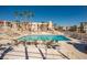 Inviting community pool with sun loungers and palm trees at 1928 Las Palmas Ln # 228, Laughlin, NV 89029
