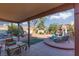 Inviting backyard features a covered patio and manicured landscaping at 1942 Old Mill Ln, Henderson, NV 89014