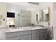 Bright bathroom with double sinks, marble countertop, and large mirror at 1942 Old Mill Ln, Henderson, NV 89014