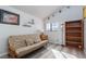 Comfortable bedroom with light wood floors and ample natural light at 1942 Old Mill Ln, Henderson, NV 89014