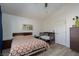 Bright bedroom with natural light, furniture and modern ceiling fan at 1942 Old Mill Ln, Henderson, NV 89014