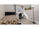 Serene bedroom with modern flooring, neutral tones, and a dedicated workspace at 1942 Old Mill Ln, Henderson, NV 89014