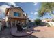 Exterior view of a home with a covered patio and well-maintained yard at 1942 Old Mill Ln, Henderson, NV 89014