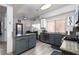 Open kitchen with granite counters, stainless appliances, and a dining area at 1942 Old Mill Ln, Henderson, NV 89014