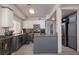 Well-lit kitchen with granite countertops, modern appliances, and grey cabinets at 1942 Old Mill Ln, Henderson, NV 89014