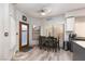 Cozy kitchen nook with seating for four, natural light, and views of the backyard at 1942 Old Mill Ln, Henderson, NV 89014