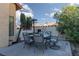 Inviting outdoor patio with a dining set, perfect for entertaining or relaxing outside the home at 1942 Old Mill Ln, Henderson, NV 89014