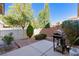 Fenced backyard featuring a patio with a barbecue grill at 2037 Brush Stroke St, Henderson, NV 89044