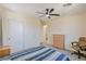 Bedroom featuring natural light, a ceiling fan, carpeted floor, and a closet with white sliding doors at 2037 Brush Stroke St, Henderson, NV 89044