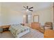 Bedroom with carpet, natural light, a ceiling fan, and a comfortable seating area at 2037 Brush Stroke St, Henderson, NV 89044