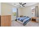 Bedroom featuring natural light, neutral walls, carpeted floors, and simple furnishings at 2037 Brush Stroke St, Henderson, NV 89044