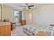 Bedroom featuring natural light, a ceiling fan, and a comfortable seating area at 2037 Brush Stroke St, Henderson, NV 89044