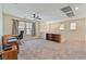 Large carpeted bonus room provides ample space, natural light, and ceiling fan at 2037 Brush Stroke St, Henderson, NV 89044
