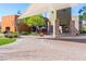 Welcoming community entrance featuring brick paving, modern buildings, and beautifully landscaped surroundings at 2037 Brush Stroke St, Henderson, NV 89044