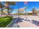 Spacious community gathering area with shaded structures, seating, and an American flag on display at 2037 Brush Stroke St, Henderson, NV 89044