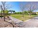 Scenic community park featuring grassy fields, mature trees, and walking paths on a bright, sunny day at 2037 Brush Stroke St, Henderson, NV 89044