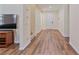 Inviting foyer with wood floors, arched doorway, and staircase at 2037 Brush Stroke St, Henderson, NV 89044