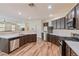 Modern kitchen features dark cabinets, stainless steel appliances, and ample counter space at 2037 Brush Stroke St, Henderson, NV 89044