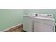 Laundry room featuring wood-look floors, washer, and dryer at 2037 Brush Stroke St, Henderson, NV 89044