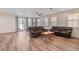 Spacious living room with comfortable seating and a view of the backyard at 2037 Brush Stroke St, Henderson, NV 89044