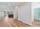 Bright living room with wood floors, large windows, and a sliding glass door at 2037 Brush Stroke St, Henderson, NV 89044