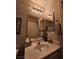 A bathroom vanity features a large mirror, modern lighting, and ample counter space at 2077 Alki Beach Ave, Laughlin, NV 89029