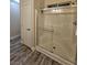 Clean bathroom with a shower, glass doors, and modern finishes, offering a comfortable and functional space at 2077 Alki Beach Ave, Laughlin, NV 89029