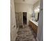 Spacious bathroom with dual sinks, ample counter space, and a separate shower area, offering luxury and convenience at 2077 Alki Beach Ave, Laughlin, NV 89029