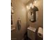 Bathroom featuring an oval mirror, modern lighting, and plenty of storage space at 2077 Alki Beach Ave, Laughlin, NV 89029