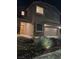Beautiful two-story home boasting a two-car garage and a desert-style rock garden at 2077 Alki Beach Ave, Laughlin, NV 89029
