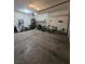 A well-lit garage with a variety of storage solutions for tools, bikes, and household items at 2077 Alki Beach Ave, Laughlin, NV 89029