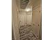 A hallway with wood-look flooring and white doors offers a clean and neutral transition between rooms at 2077 Alki Beach Ave, Laughlin, NV 89029
