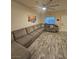 Spacious living room featuring laminate floors, natural light, and neutral paint at 2077 Alki Beach Ave, Laughlin, NV 89029