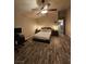 Spacious main bedroom with hardwood floors, ceiling fan, and ample natural light, offering a serene retreat at 2077 Alki Beach Ave, Laughlin, NV 89029