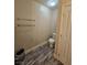 Simple powder room with modern flooring and neutral colors, providing convenience for guests at 2077 Alki Beach Ave, Laughlin, NV 89029