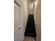 The stairwell features hardwood floors and a white handrail at 2077 Alki Beach Ave, Laughlin, NV 89029