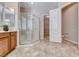 Well-appointed bathroom featuring a glass-enclosed shower, tile flooring, and a doorway to the walk-in closet at 2114 Twin Falls Dr, Henderson, NV 89044