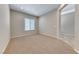 Bright bedroom boasting neutral walls, soft carpet, recessed lighting, and a window at 2114 Twin Falls Dr, Henderson, NV 89044