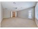 Generous bedroom with a ceiling fan, recessed lighting, neutral carpet, and access to an outdoor balcony at 2114 Twin Falls Dr, Henderson, NV 89044