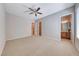 Spacious bedroom featuring plush carpeting, neutral paint, and a ceiling fan at 2114 Twin Falls Dr, Henderson, NV 89044