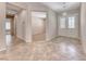 Bright foyer showcasing tile flooring, an elegant chandelier, and views into adjacent living spaces at 2114 Twin Falls Dr, Henderson, NV 89044