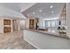 Well-lit kitchen with granite countertops, and ample cabinet space seamlessly flowing into the adjacent living space at 2114 Twin Falls Dr, Henderson, NV 89044
