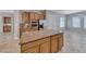 Kitchen island with granite countertop offers extra prep space and complements the stainless steel appliances at 2114 Twin Falls Dr, Henderson, NV 89044