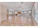 Spacious open-concept living room featuring tile flooring, recessed lighting, and a view of the kitchen at 2114 Twin Falls Dr, Henderson, NV 89044