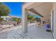 Spacious back patio with stone accents and an outdoor seating area at 2320 Anderson Park Dr, Henderson, NV 89044