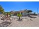 Spacious backyard with desert landscaping, rock garden and mature palms, offering relaxation and low maintenance at 2320 Anderson Park Dr, Henderson, NV 89044