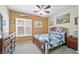 Bedroom with wood frame bed, neutral walls, and a bright window at 2320 Anderson Park Dr, Henderson, NV 89044