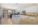 Well-equipped kitchen boasts stone countertops, stainless steel appliances, and white cabinets at 2320 Anderson Park Dr, Henderson, NV 89044