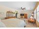 Comfortable main bedroom with large window and neutral walls at 2320 Anderson Park Dr, Henderson, NV 89044